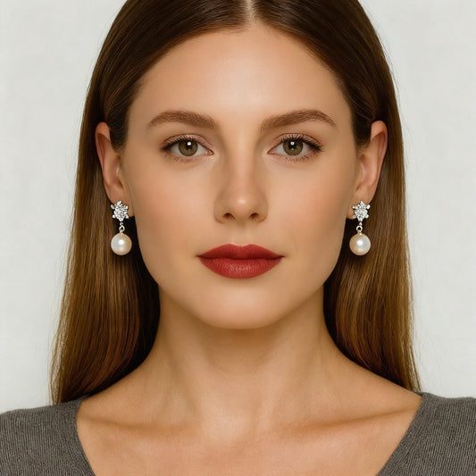 Freshwater Pearl Earrings - Mist Asterisk worn by a model, showcasing near-round pearls and sterling silver details.