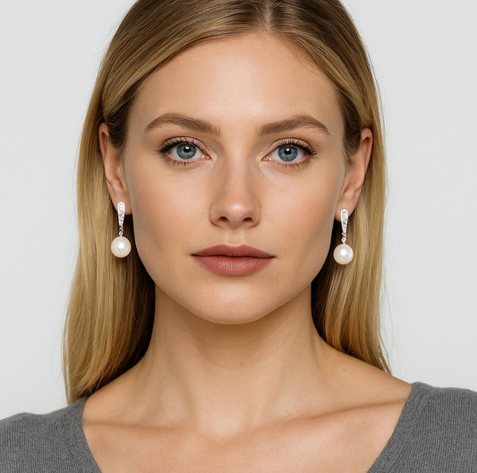 Looking for elegant pearl earrings? Model shows freshwater pearls in sterling silver night exclamation studs on both ears | MINTING Jewelry